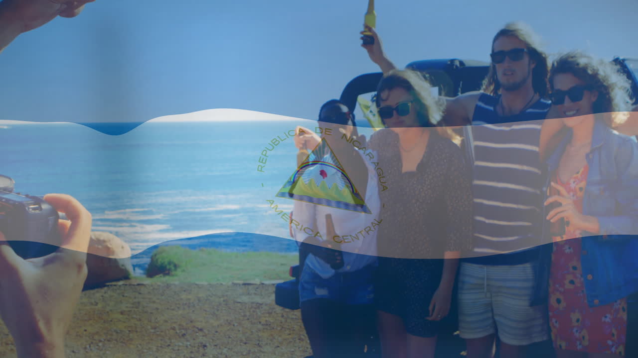 Celebrating by ocean, group of friends with Nicaragua flag animation overlay