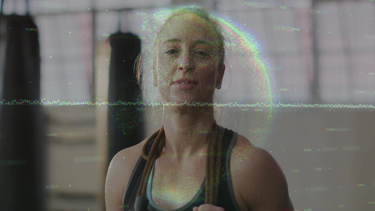 Woman holding jump rope in fitness studio, tilting head and catching breath after skipping