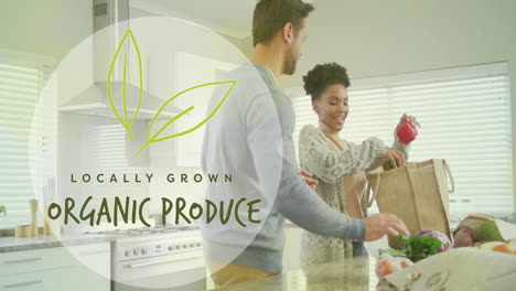 animation of organic produce text over diverse couple preparing healthy meal in kitchen