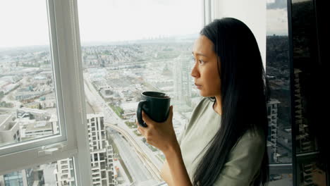 Woman-having-coffee-at-home-4k