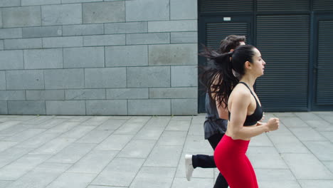 Fitness-couple-running-outdoor.-Athlete-woman-and-man-jogging-together