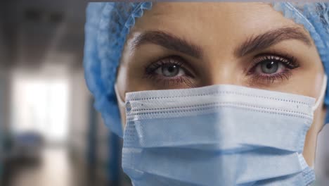 Animation-of-flag-of-usa-waving-over-surgeon-in-operating-theatre