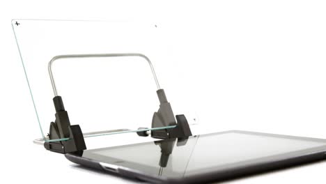 Close-up-of-glass-on-digital-stand-with-digital-tablet