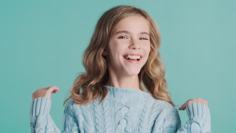 teenage caucasian girl laughing at the camera.