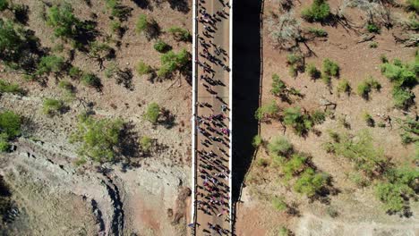 overhead drone view of people in the freedom day festival march in the remote community of kalkaringi, northern territory, australia