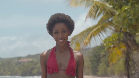 close-up of a black girl with an amazing afro hairstyle walking forward