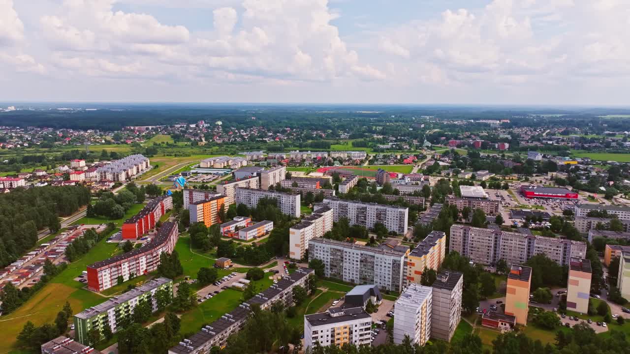 Colorful apartments and Soviet-style blocks expand as backward drone, Salaspils