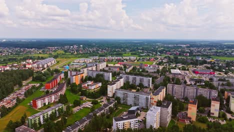 colorful apartments and soviet-style blocks expand as backward drone, salaspils