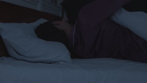 woman sleeping in bed at night