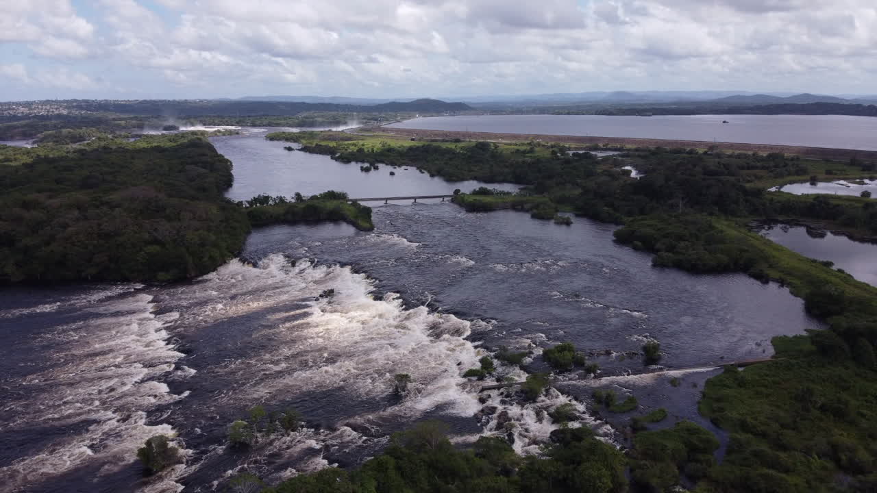 Aerial View of a River with Waterfall and Dam