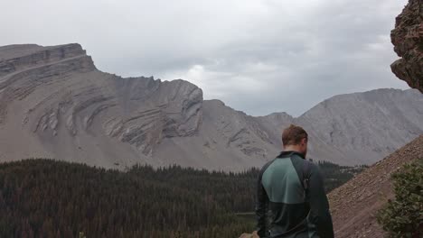 Hikers-on-trail-depart-followed-close-up-pan