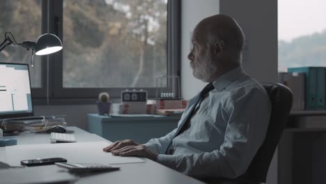 bored businessman sitting in the office