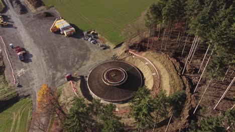 wind turbine base under construction on the rural fields near germany countryside