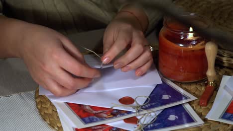 Caucasian-women-preparing-Christmas-letters-for-family