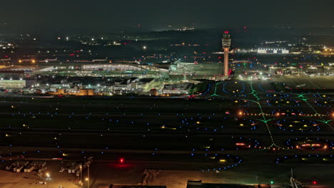 Atlanta-Georgia-Aerial-v887-night-hyperlapse,-flyover-Hapeville-College-Park-capturing-busy-Hartsfield-airport-runway-activities-and-air-traffic-control-tower---Shot-with-Mavic-3-Pro-Cine---June-2023