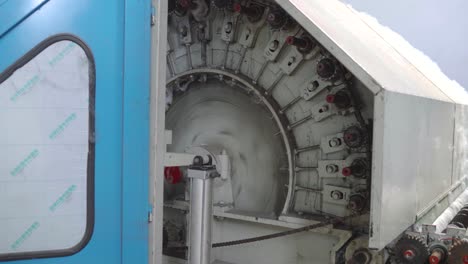 knitting circular machine inside textile factory, closeup