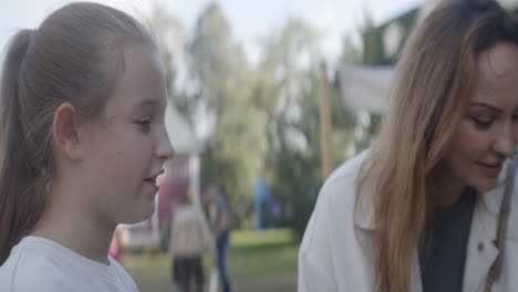 mother and daughter at an outdoor event