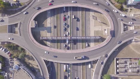 Beautiful-aerial-of-Roundabout-and-highway,-4k-summer-day-traffic