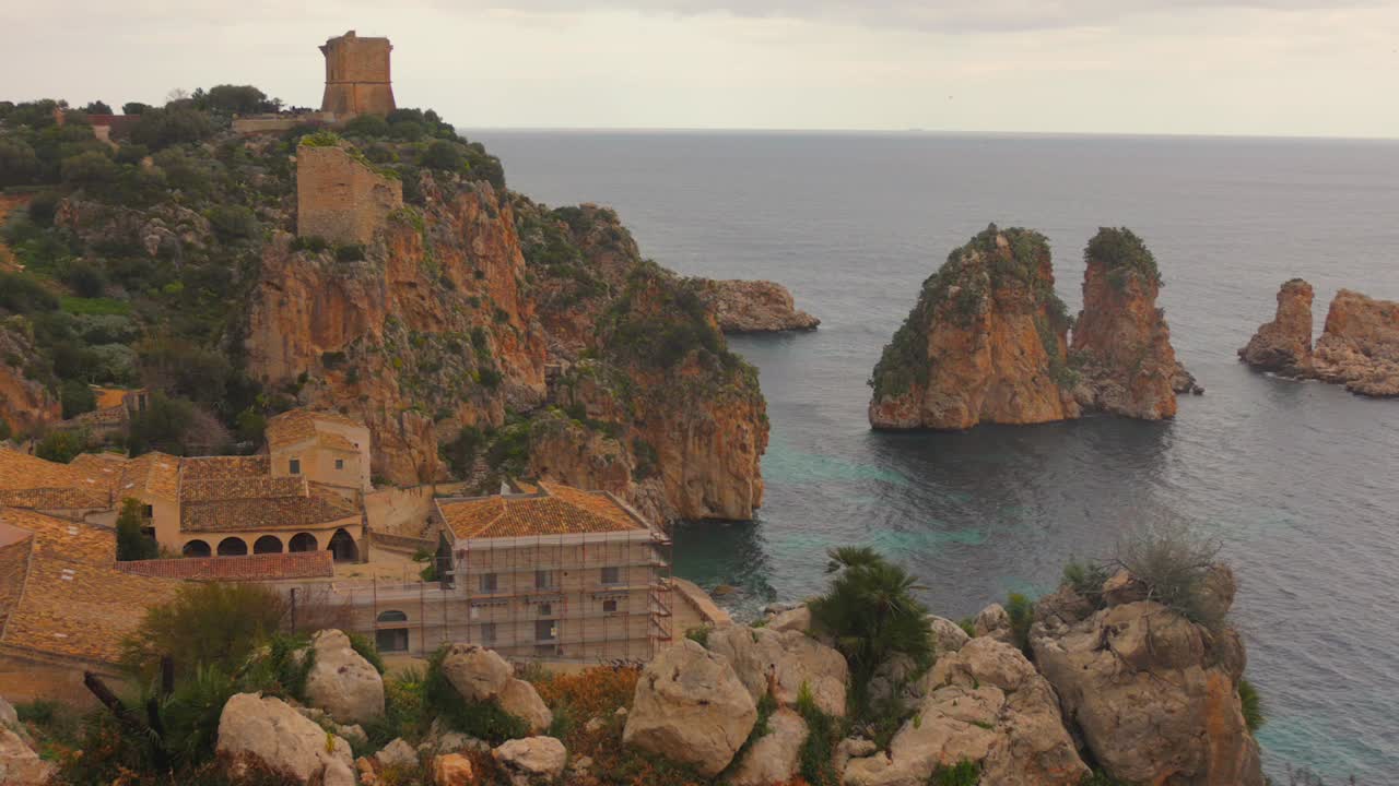 Breathtaking view of Sicily’s coast, showcasing rocky cliffs and crystal-clear waters
