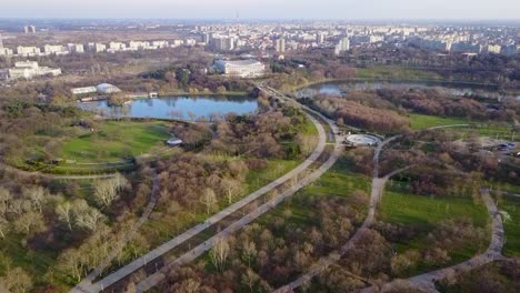 Flying-upwards,-looking-at-Park-Tineretului-of-Bucharest,-Romania