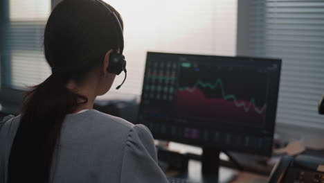 businesswoman analyzing financial data on computer