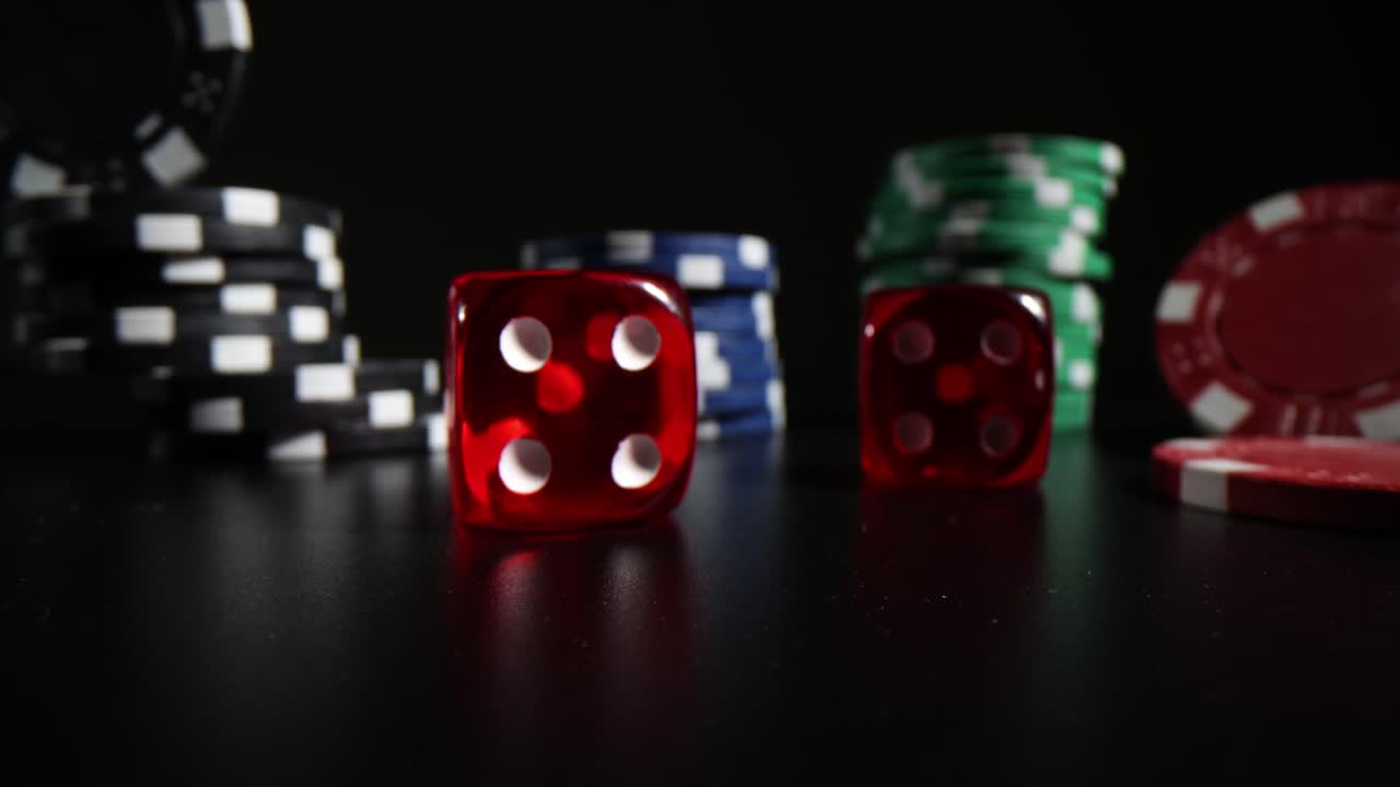 Red Dice and Poker Chips on a Dark Background