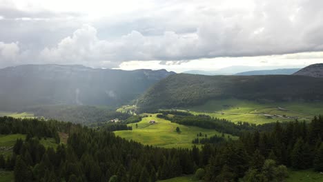 Beautiful-cinematic-light-pierces-through-the-clouds-during-a-storm-in-the-french-alps