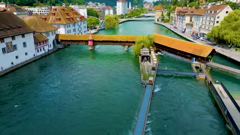 4k drone video of the spreuerbrücke bridge and lucerne needle dam on the reuss river near lake luzerne in lucerne, switzerland