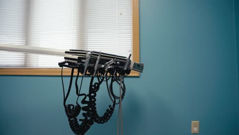 dental tools on a tray inside of a dental office used for teeth cleaning