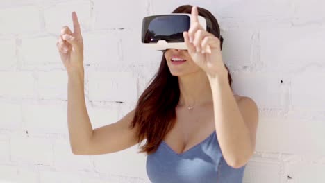 Young-woman-wearing-virtual-reality-goggles