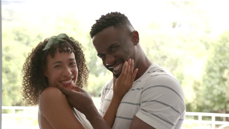 embracing and enjoying time together outdoors, smiling couple