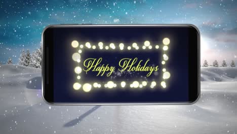 Animation-of-happy-holidays-text-and-fairy-lights-displayed-on-smartphone-screen-with-winter-scenery