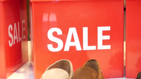 red sale signs and shoes