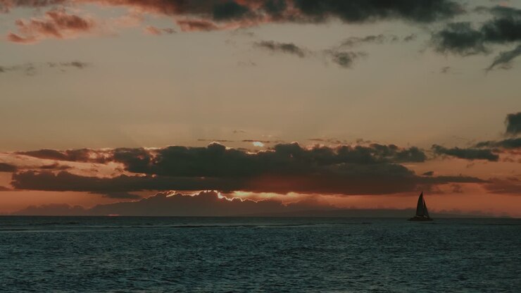 Wonderful sunset with a sailingboat