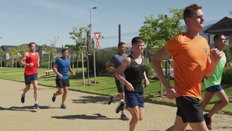 Men-running-outside-on-sunny-day