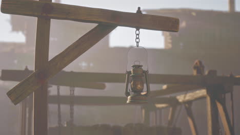 rusty lantern hanging in abandoned ruins