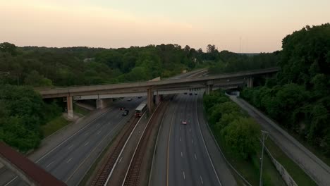 train and cars passing through georgia state route 400