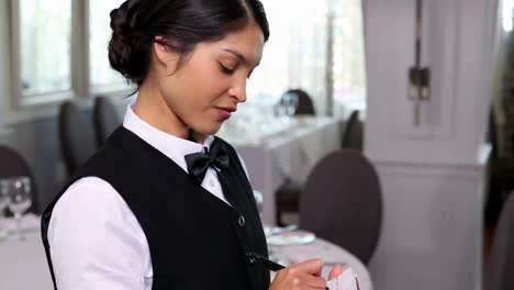 Pretty-waitress-taking-an-order