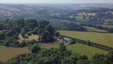 Flying-over-rural-English-country,-AERIAL-TILT-UP