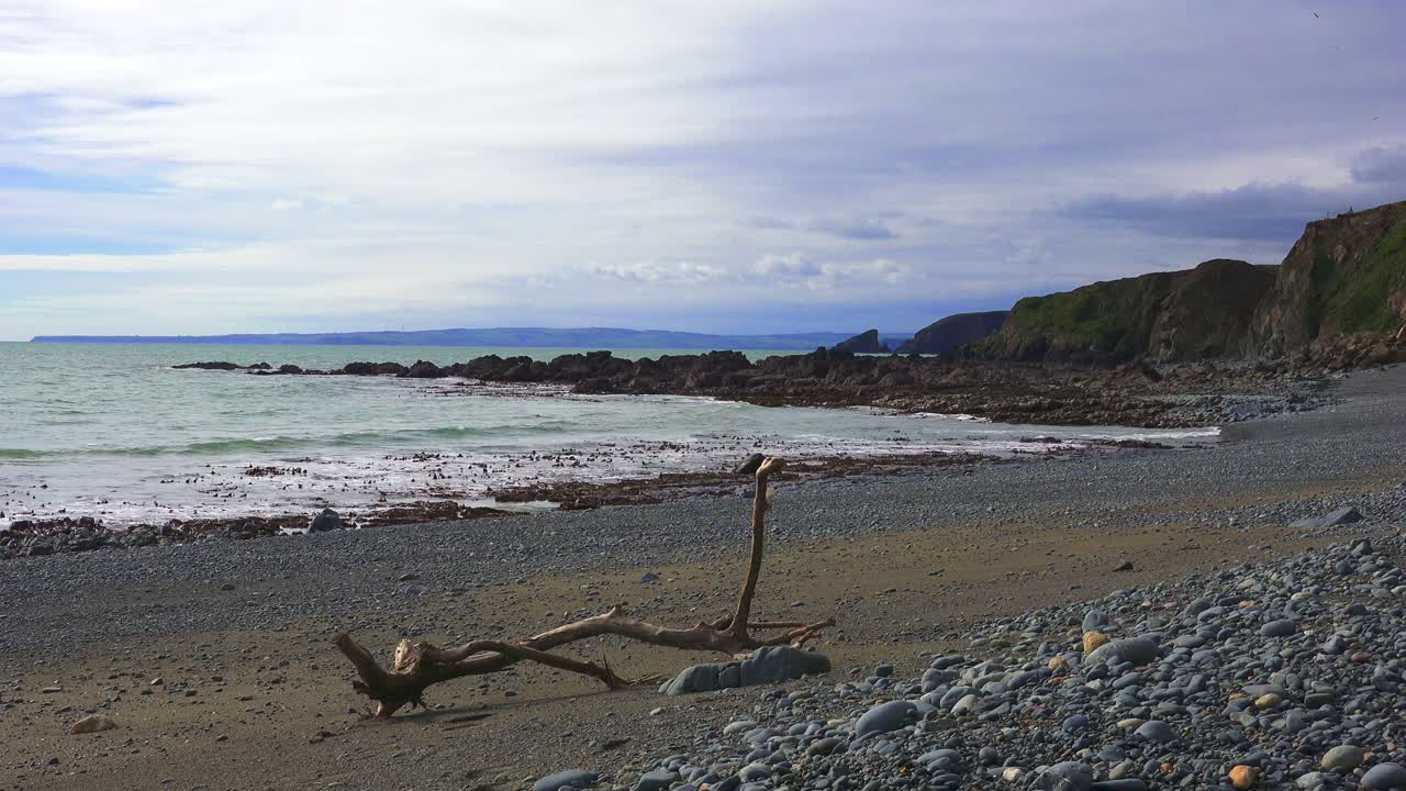 Tranquil beach Irish seascapes driftwood on pebble beach oasis of peace Copper Coast Waterford Ireland Epic Locations