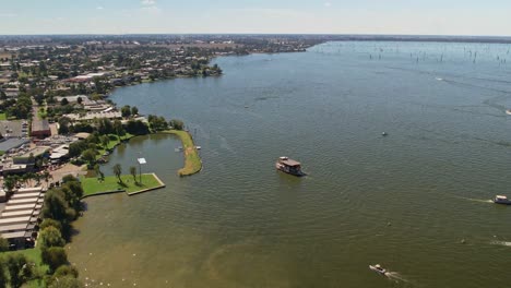 the paddle steamer cumberoona sailing past the mulwala ski club in mulwala, nsw, australia