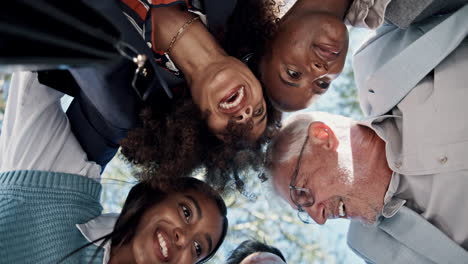 diverse group of smiling people looking down