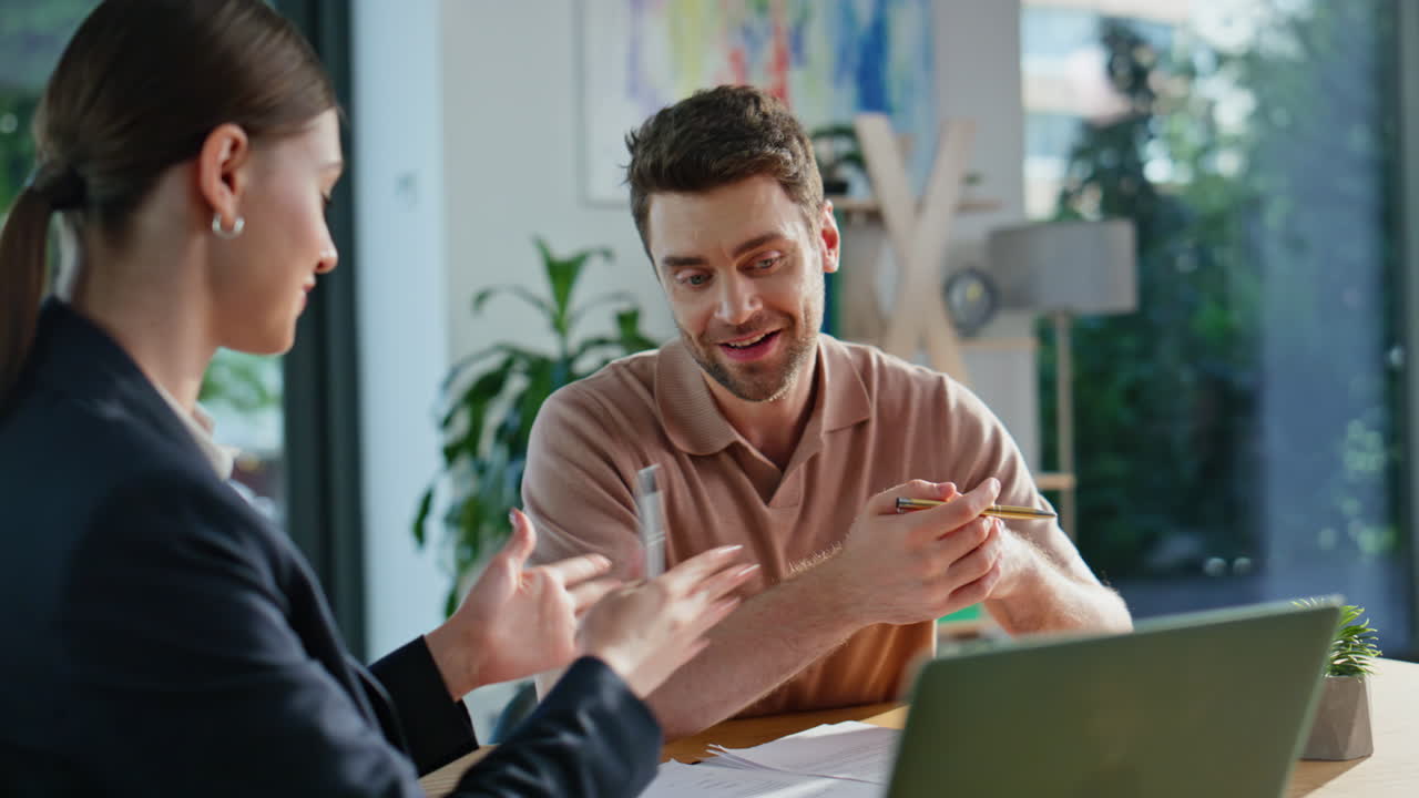 Consultant advising investment project to man showing laptop at office closeup