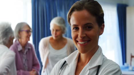 Portrait-of-female-doctor-standing-with-arms-crossed-4k