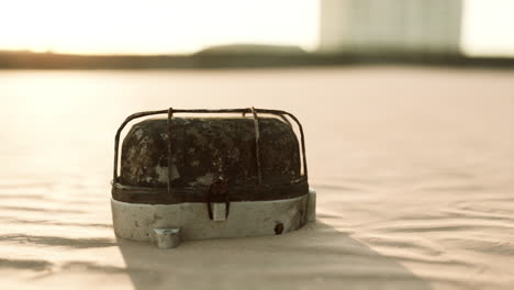 old rusted trash on the sand beach