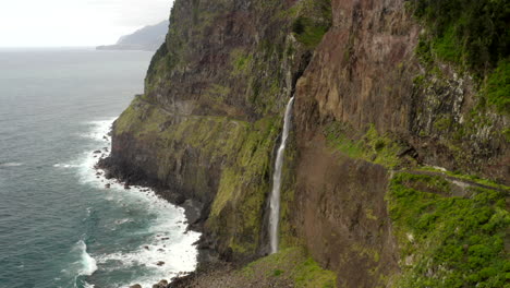 drone aerial footage of north coast of madeira flying towards véu da noiva waterfall in portugal