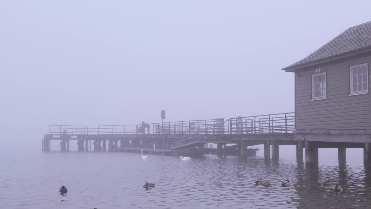 Loch Lomond Pier on a misty evening.