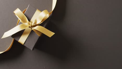 Video-of-christmas-gift-and-copy-space-on-black-background