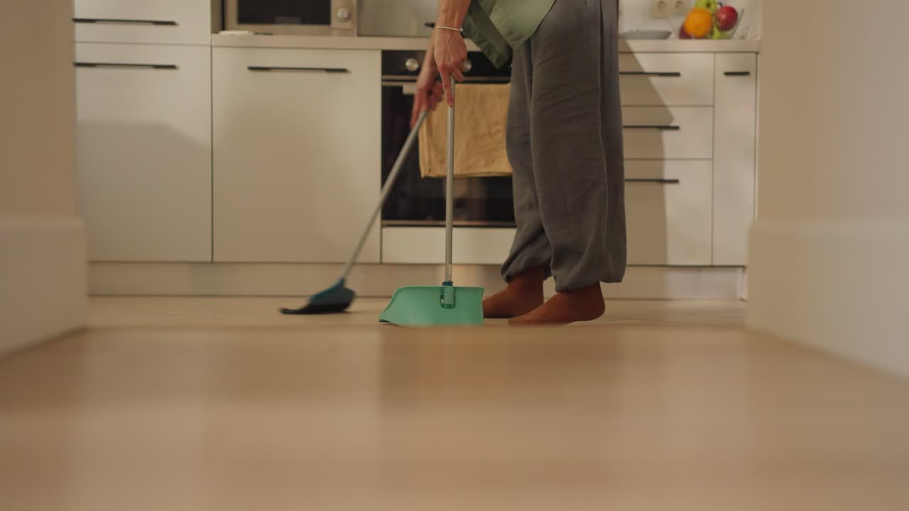 Sweeping the kitchen floor