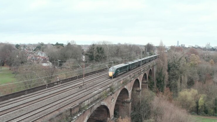 follow drone shot of Great western railway javelin high speed train over Wharncliffe viaduct London